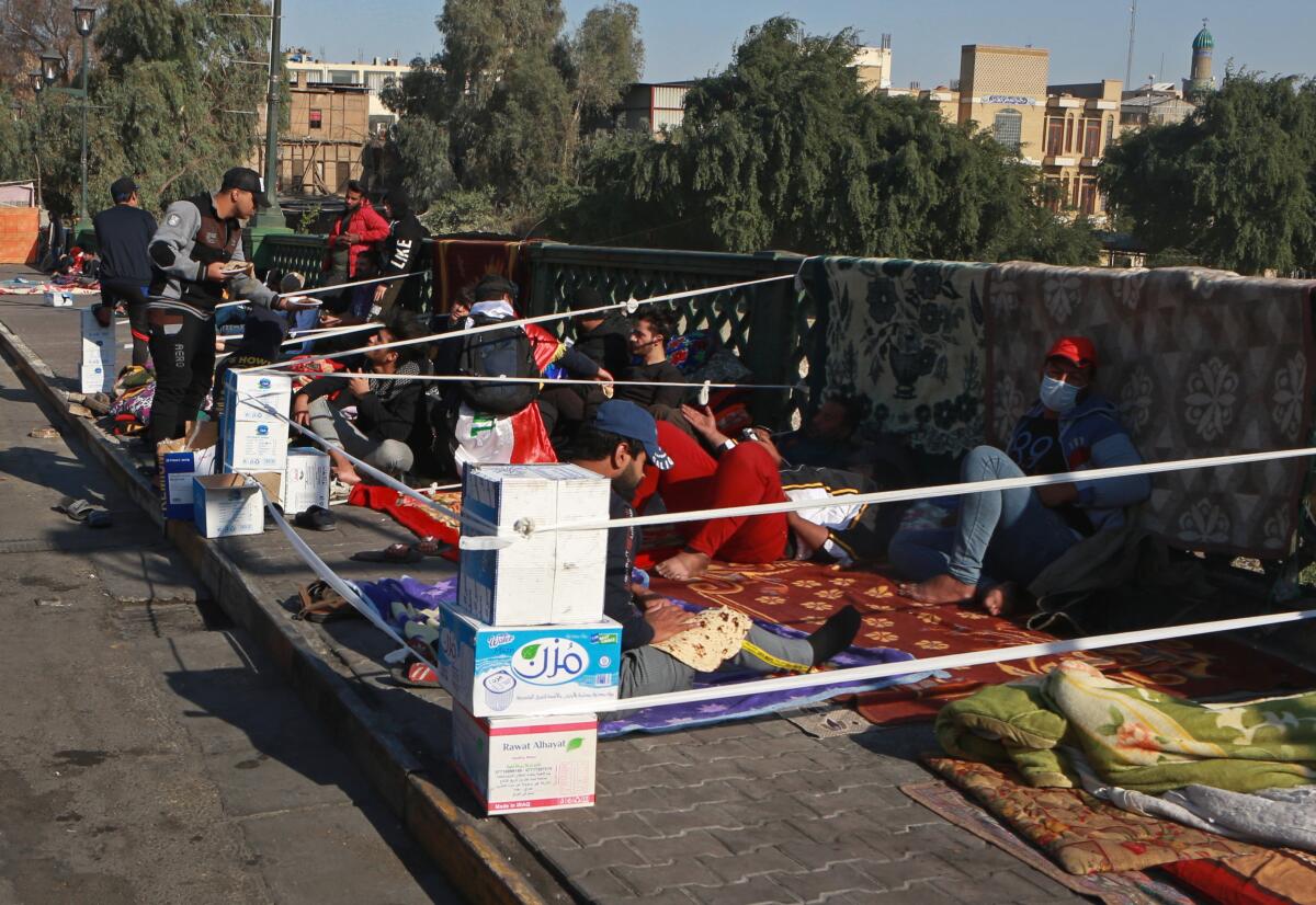 Antigovernment protesters stage a sit-in Nov. 20 on the Ahrar Bridge in Baghdad.