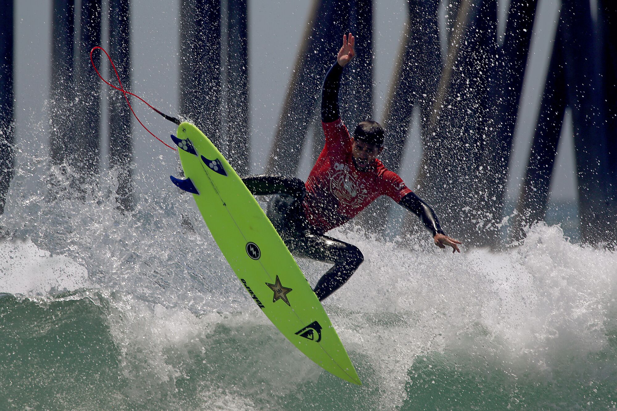 Ezekial Lau of Hawaii catches some air on his board on his way to winning the 2022 U.S. Open of Surfing.