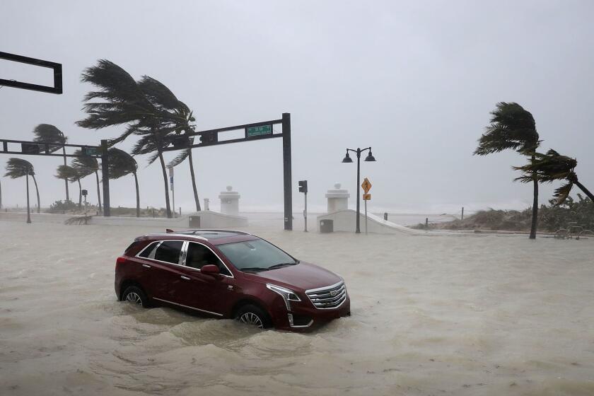 FORT LAUDERDALE, FL - SEPTEMBER 10: A car sits abandoned in storm surge along North Fort Lauderdale Beach Boulevard as Hurricane Irma hits the southern part of the state September 10, 2017 in Fort Lauderdale, Florida. The powerful hurricane made landfall in the United States in the Florida Keys at 9:10 a.m. after raking across the north coast of Cuba. (Photo by Chip Somodevilla/Getty Images) ** OUTS - ELSENT, FPG, CM - OUTS * NM, PH, VA if sourced by CT, LA or MoD **