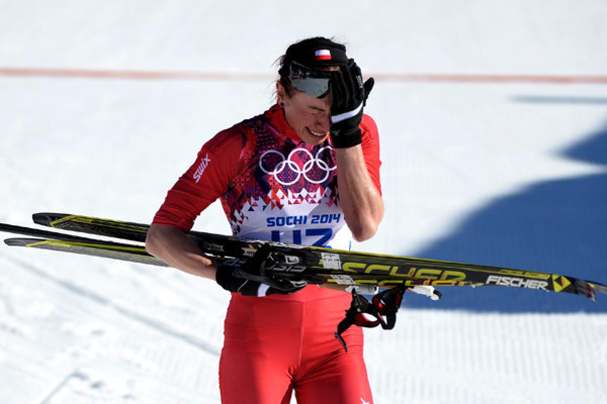 Justyna Kowalczyk reacts after winning the women's cross-country 10-kilometer classical race on Thursday at the Sochi Olympics.