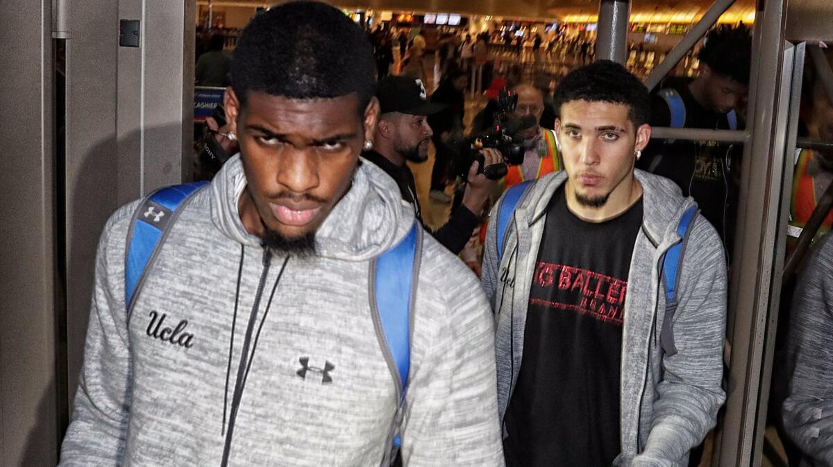 UCLA basketball players caught shoplifting while on a team trip to China, Cody Riley, left, Jalen Hill, not pictured, and LiAngelo Ball return from Shanghai, China at LAX on Nov. 14, 2017.