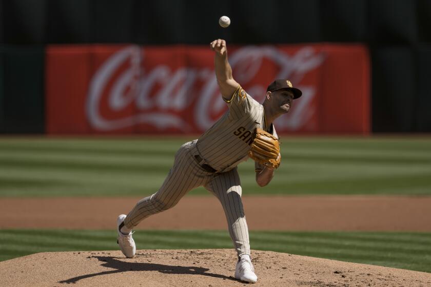 San Diego Padres pitcher Nick Martinez throws to an Oakland Athletics batter during the first inning of a baseball game, Sunday, Sept. 17, 2023, in Oakland, Calif. (AP Photo/Godofredo A. Vásquez)