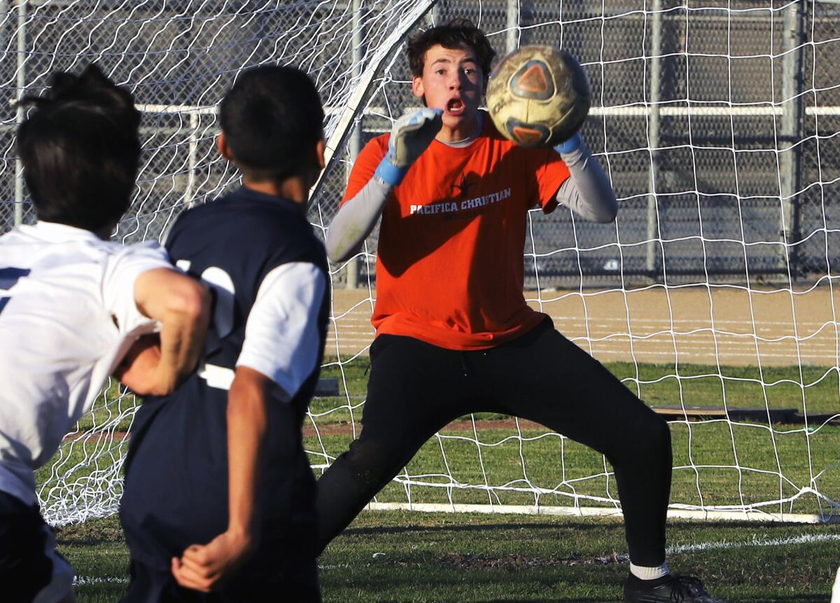 Pacifica Christian goalkeeper Ethan Shumlas makes a save against South El Monte's Alexander Morales (12).