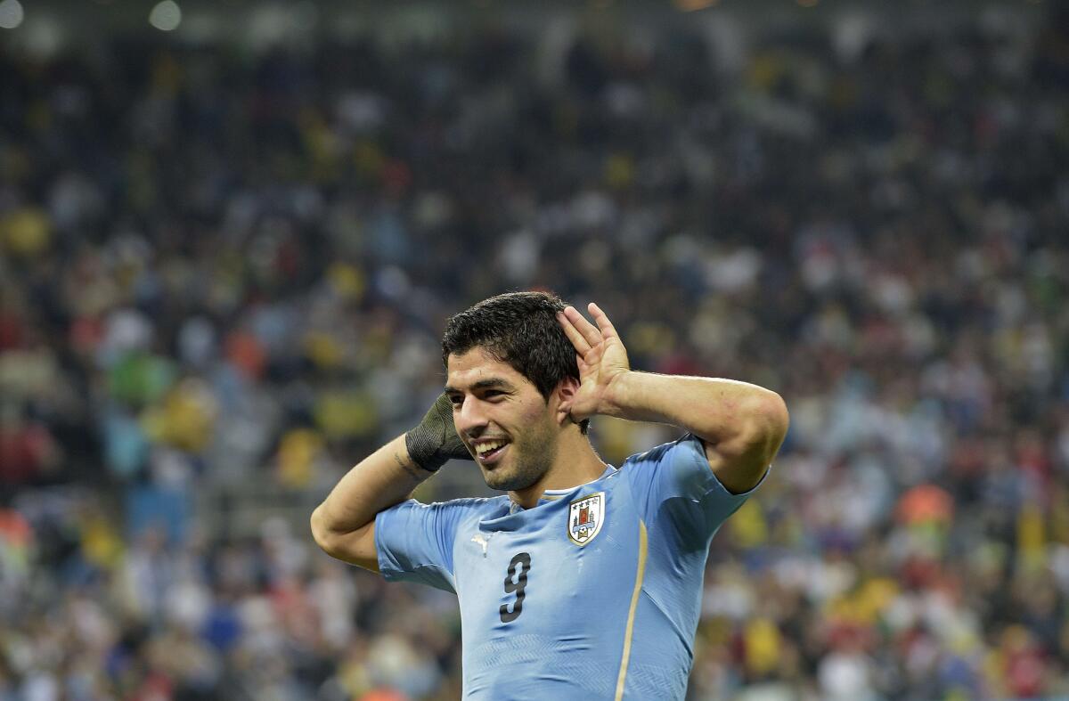 Uruguay's forward Luis Suarez celebrates after scoring during a Group D football match between Uruguay and England at the Corinthians Arena in Sao Paulo during the 2014 FIFA World Cup on June 19, 2014. AFP PHOTO / DANIEL GARCIADANIEL GARCIA/AFP/Getty Images ORG XMIT: 491716423