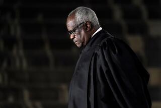Justice Clarence Thomas listens as President Trump speaks before administering the Constitutional Oath to Amy Coney Barrett.