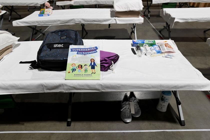 LONG BEACH, CA - APRIL 22: Sleeping quarters set up inside Exhibit Hall B for migrant children are shown during a tour of the Long Beach Convention Center on April 22, 2021 in in Long Beach, California. Long Beach officials and officials with the U.S. Department of Health and Human Services led the tour. Migrant children found at the border without a parent were scheduled to be temporarily housed at the facility beginning today. Officials say the center can accommodate up to 1,000 children. (Photo by Brittany Murray-Pool/Getty Images