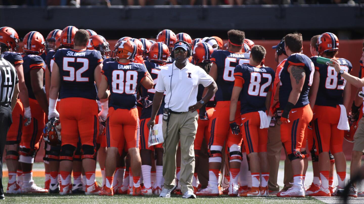 Illini head coach Lovie Smith breaks from a team huddle in the first half against Murray State at Memorial Stadium on Sept. 3, 2016.