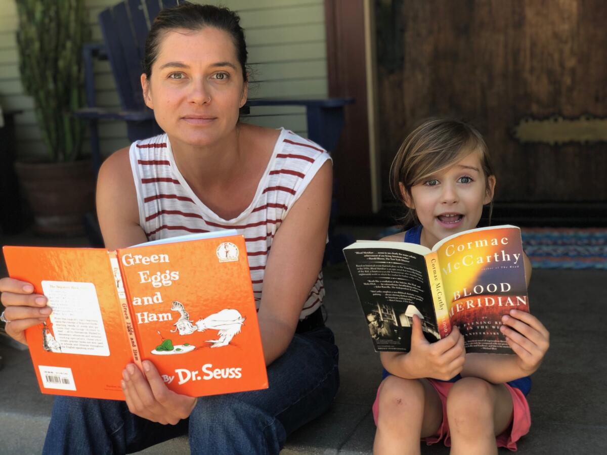 Ivy Pochoda and her daughter, Loretta, with their favorite books.