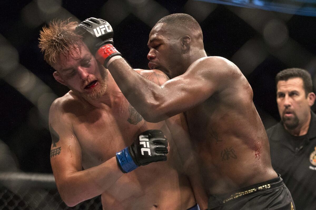 Jon Jones, right, battles Alexander Gustafsson during their light-heavyweight fight at UFC 165 on Saturday night.