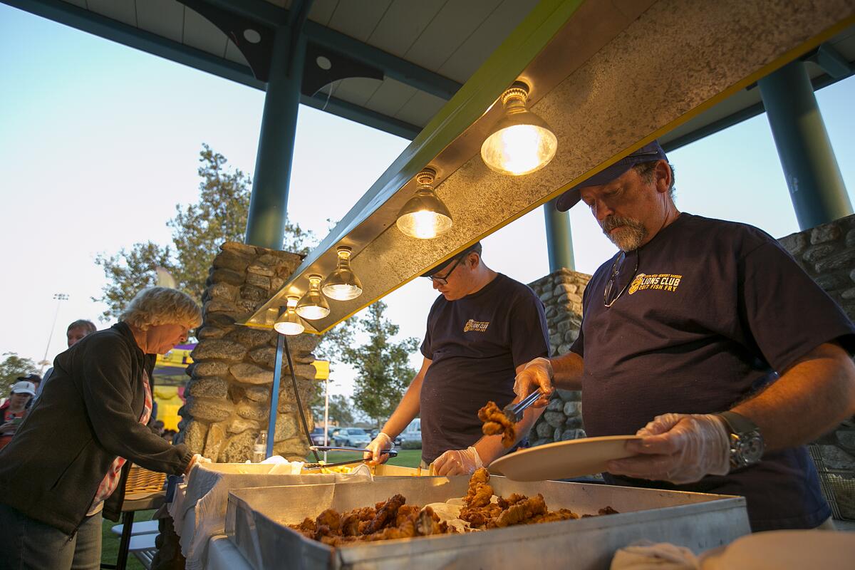 Vincent Williams, left, and Kirk Bauermeister at the Newport Harbor Lions Club's 70th annual fish fry in 2017.