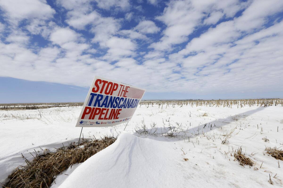 A sign opposing the Keystone XL pipeline appears in a field near Bradshaw, Neb.