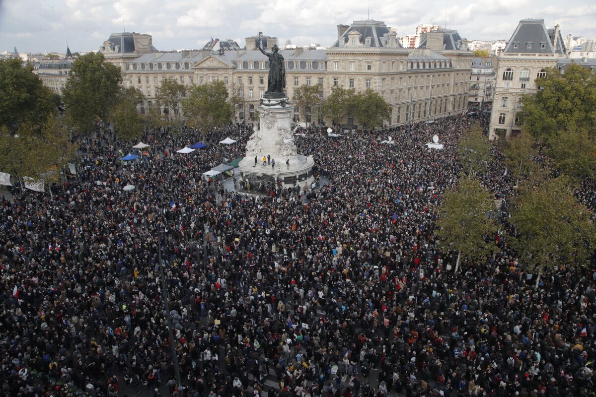 Hundreds of people gather on Republique square during a demonstration Sunday in Paris. 