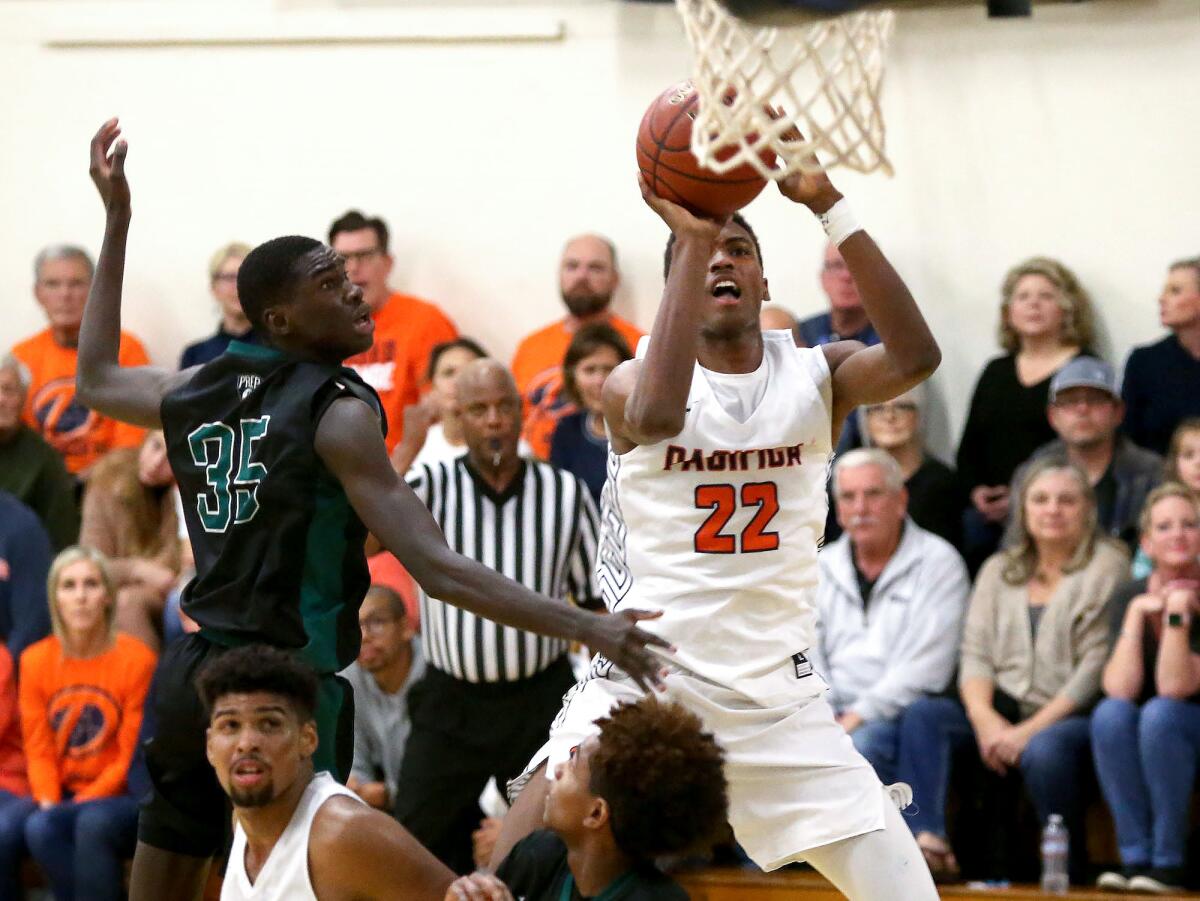 Pacifica Christian Orange County’s Judah Brown (22), shown taking a jumper in a Jan. 31 game against Fairmont Prep, led the Tritons to a 63-55 win at Saddleback Valley Christian on Thursday.