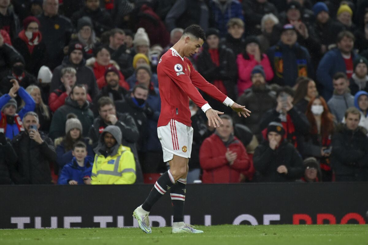 Manchester United's Cristiano Ronaldo celebrates scoring his side's first goal during the English Premier League soccer match between Manchester United and Brighton & Hove Albion at Old Trafford stadium, in Manchester, England, Tuesday, Feb. 15, 2022. (AP Photo/Rui Vieira)