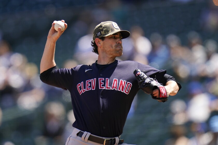 Cleveland Indians starting pitcher Shane Bieber throws against the Seattle Mariners in the first inning of a baseball game Sunday, May 16, 2021, in Seattle. (AP Photo/Elaine Thompson)