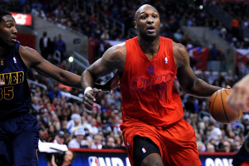 Clippers' Lamar Odom plays against Denver on Dec. 25, 2012.