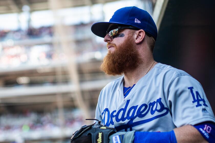 WASHINGTON, DC - JULY 27: Justin Turner #10 of the Los Angeles Dodgers looks on in the dugout during the game between the Los Angeles Dodgers and the Washington Nationals at Nationals Park on Saturday, July 27, 2019 in Washington, District of Columbia. (Photo by Rob Tringali/MLB Photos via Getty Images)