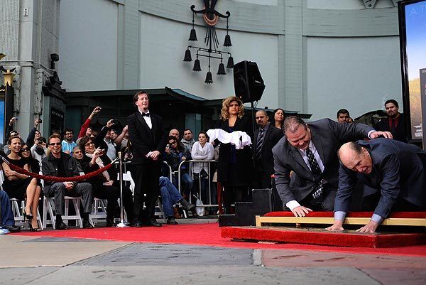Duvall places his hands in wet concrete on the Walk of Fame.