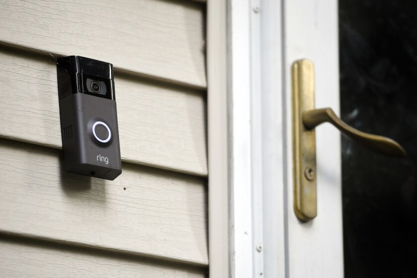 FILE - a Ring doorbell camera is seen installed outside a home in Wolcott, Conn., on July 16, 2019. Amazon has provided Ring doorbell footage to law enforcement 11 times this year without the user’s permission, a revelation that’s bound to raise more privacy and civil liberty concerns about its video-sharing agreements with police departments across the country. The disclosure came in a letter from the company that was made public Wednesday, July 13, 2022, by U.S. Sen. Edward Markey, D-Mass. (AP Photo/Jessica Hill, File)