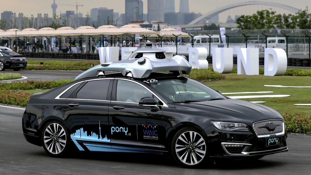 A driverless car from Pony.ai makes its way during the World Artificial Intelligence Conference 2018 in Shanghai.