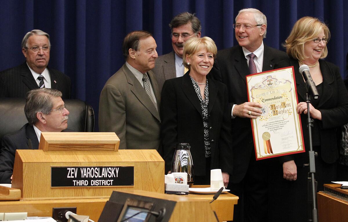 Three would-be candidates have taken the first formal step toward succeeding Los Angeles County Supervisors Don Knabe, standing at left, and Michael D. Antonovich, second from right, shown here in 2012.