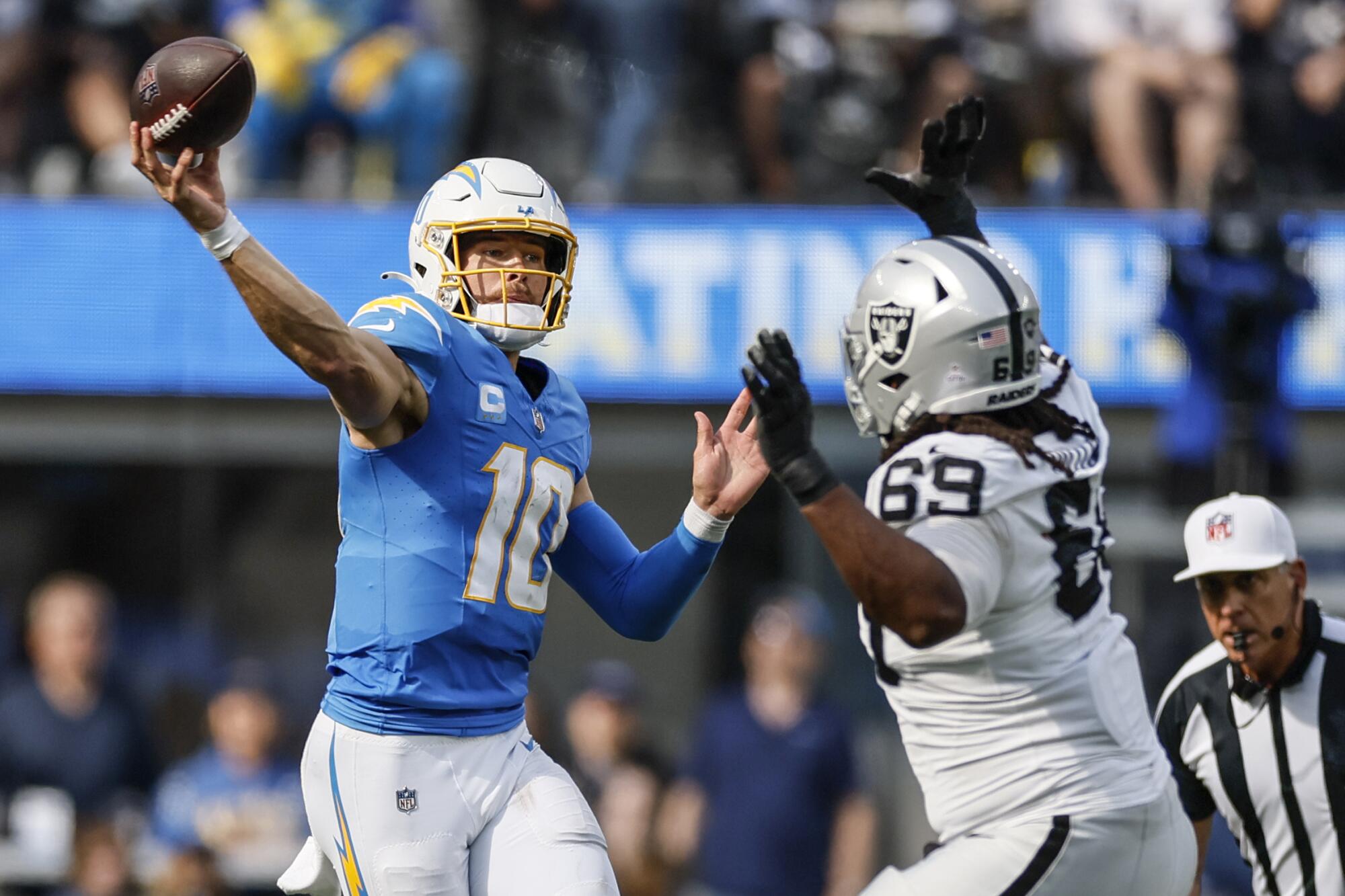 Chargers quarterback Justin Herbert passes against the Raiders during a game in October 2023.