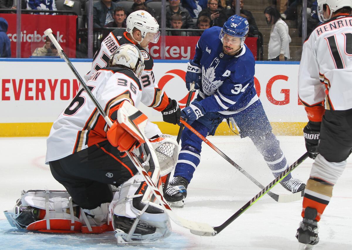 Toronto Maple Leafs forward Auston Matthews scores his third goal of the game past Ducks goaltender John Gibson.