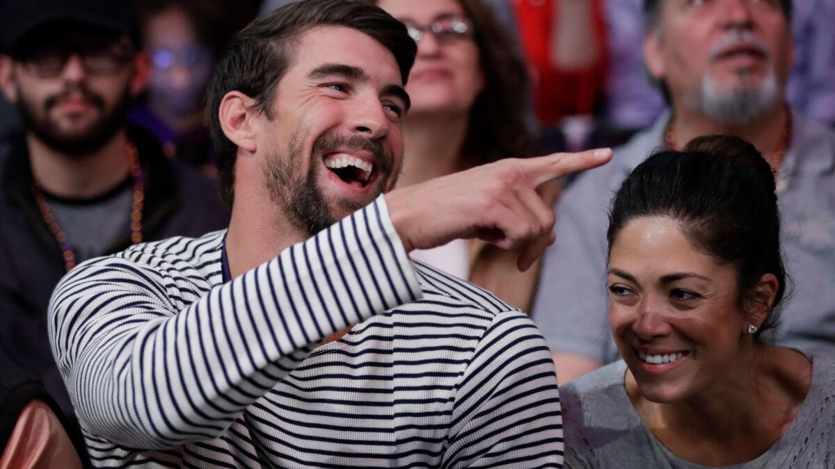 Michael Phelps with his wife, Nicole Johnson, at a Lakers-Clippers game at Staples Center on March 21.