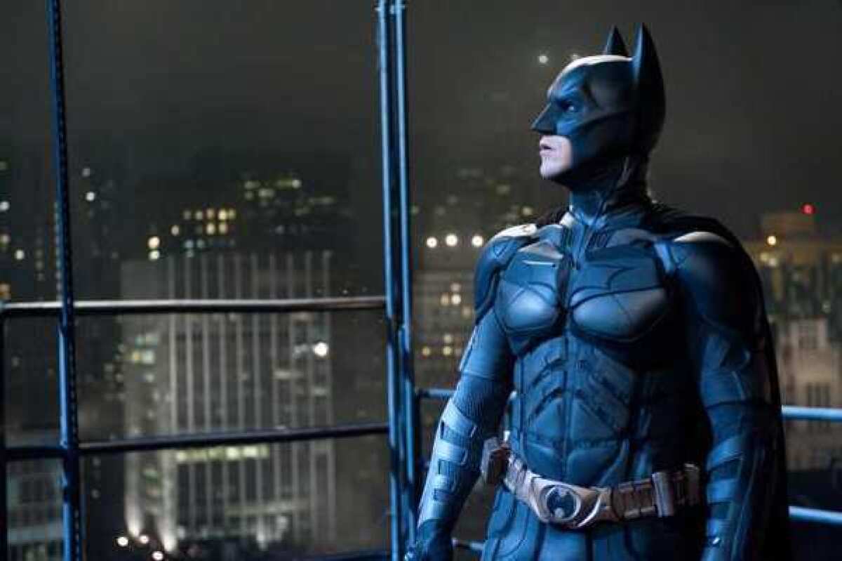 Christian Bale portrays Bruce Wayne and Batman in a scene from "The Dark Knight Rises."
