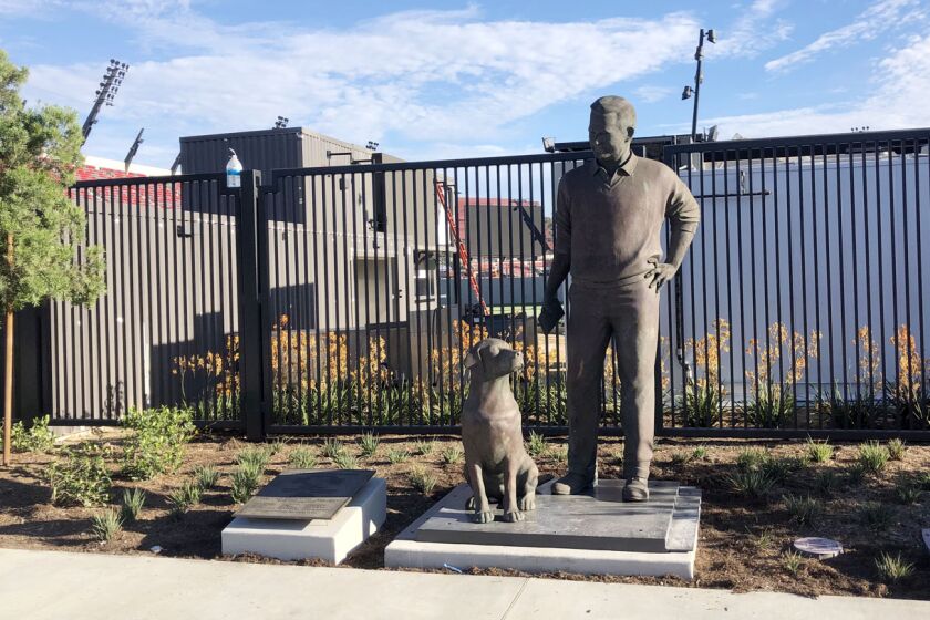 The statue of former San Diego Union editor/columnist Jack Murphy is located outside north entrance of Snapdragon Stadium.