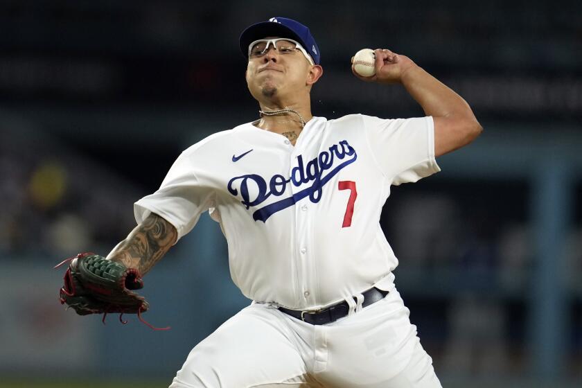 Los Angeles Dodgers starting pitcher Julio Urias throws to a Colorado Rockies.