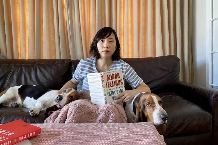 Author Steph Cha sheltering in place with her two basset hounds