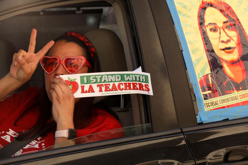 LOS ANGELES, CA - FEBRUARY 20, 2021 - - Lorraine Quinones, a fourth-grade teacher at Multnomah Elementary Schoo, joins demonstrators in a car caravan to not force Los Angeles county school re-openings until safe in front of outside of the Ronald Reagan State Office Building in downtown Los Angeles on February 20, 2021. Parents, students, educators, and community members concerned with calls from Governor Newsom and local politicians to return to in-person schooling demanding for stronger safety measures and an end to educational racism. The "Not My Child: Schools Are Not Safe" demonstration want all school staff having access to vaccinations; smaller class sizes to ensure social distancing; necessary sanitation and PPE; and for every zip code in LAUSD to be out of the purple tier. (Genaro Molina / Los Angeles Times)