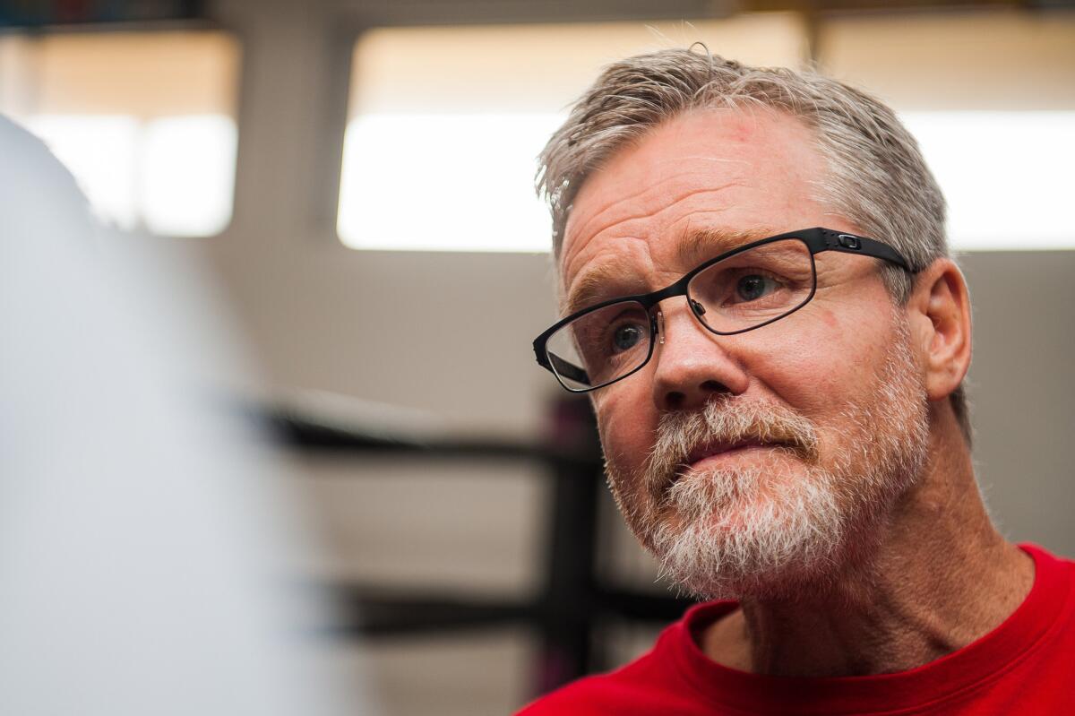 Boxing trainer Freddie Roach talks with the media before a workout session in Hollywood.