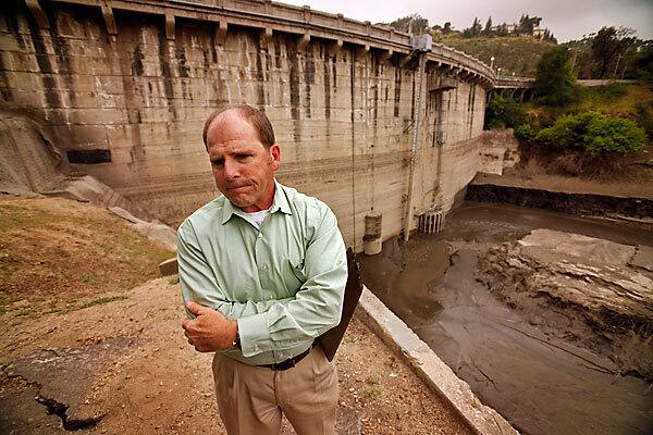 Steve Sheridan is an engineer with the Los Angeles County Department of Public Works, which has sternly warned of the flood risk at Devil's Gate Dam in Pasadena. The wildlife-rich riparian habitat, a rarity in the county, has become an oasis for joggers, hikers and equestrians.
