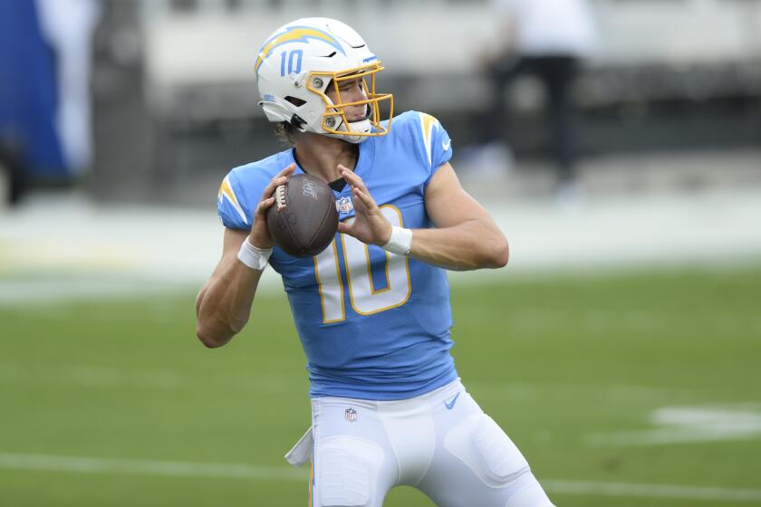 Chargers quarterback Justin Herbert warms up before Sunday's game at Tampa Bay.