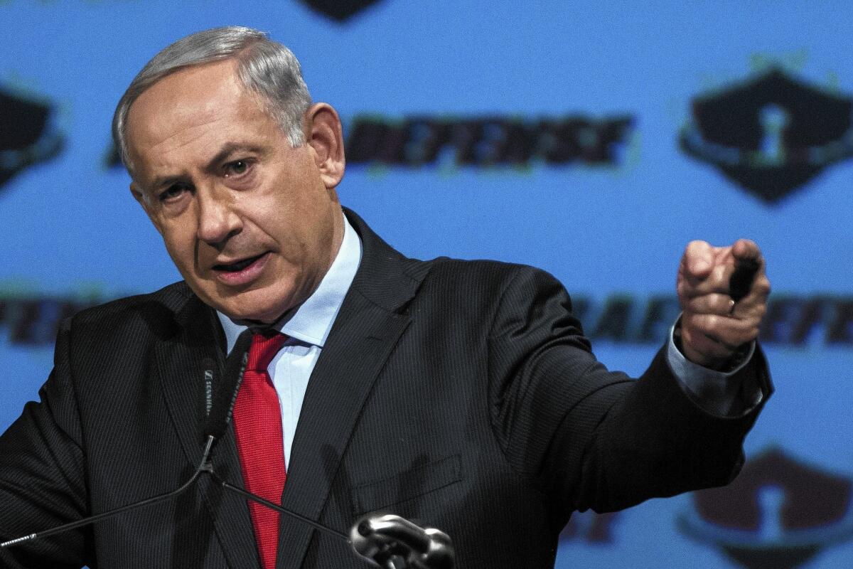 Israeli Prime Minister Benjamin Netanyahu gives a speech in Tel Aviv. He declared over the weekend in Davos, Switzerland, that he does not intend “to remove a single settlement” from the Palestinian territories or uproot a single Jew as part of the peace process.