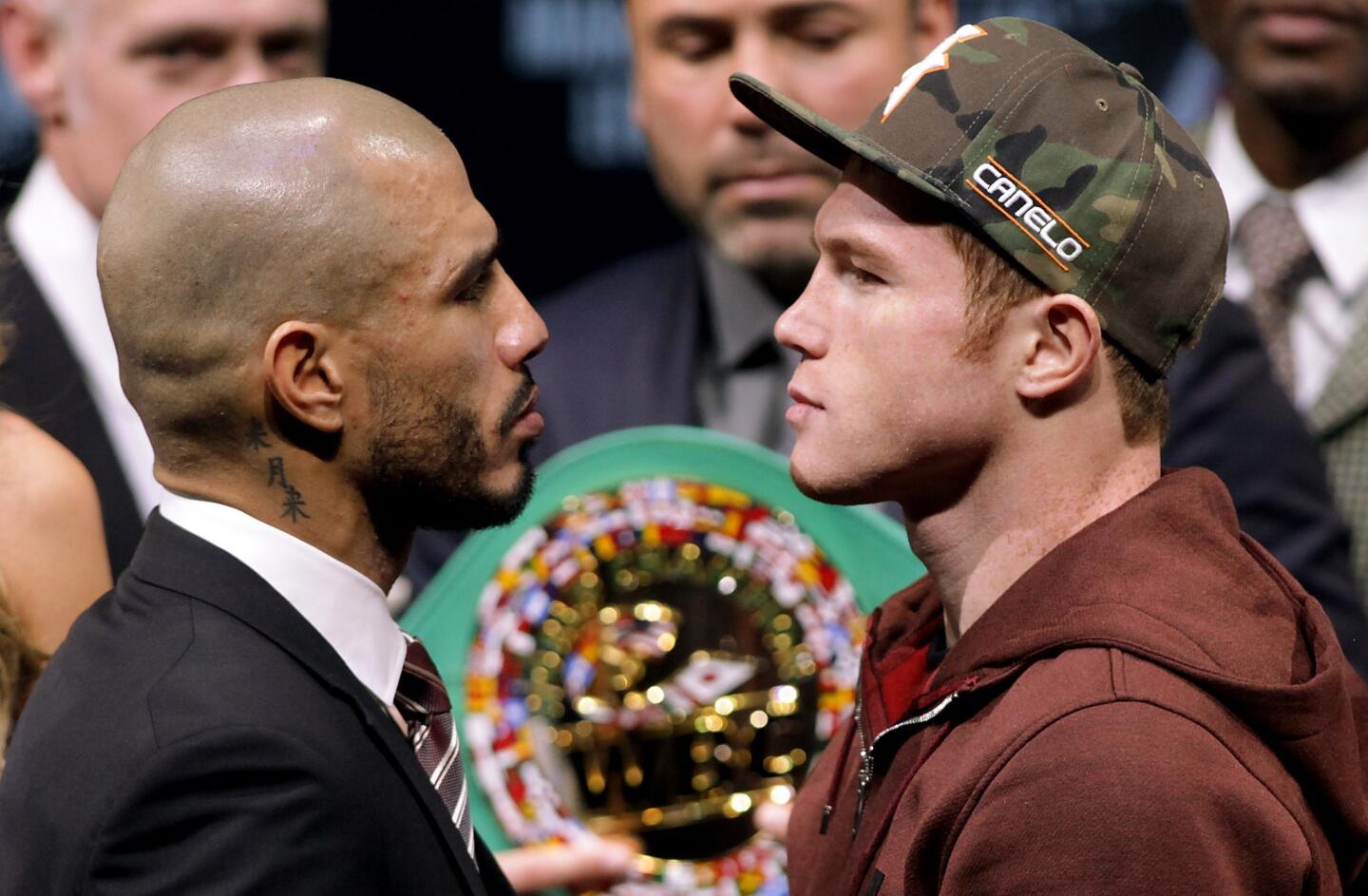Former WBC Middleweight World Champion Miguel Cotto (L), from Puerto Rico and two time world champion, Saul 'Canelo' Alvarez from Guadalajara, Mexico face-off during a press conference in Las Vegas, Nevada on November 18, 2015. Cotto was stripped of his World Boxing Council middleweight world title on Tuesday, days before his anticipated bout against Mexican Saul Alvarez in Las Vegas on Saturday. Amid reports that Cotto declined to pay the USD 300,000 sanctioning fee for a title fight, the WBC said in a statement only that the Puerto Rican and his camp failed to comply with WBC regulations. AFP PHOTO/ John GurzinskiJOHN GURZINSKI/AFP/Getty Images ** OUTS - ELSENT, FPG, CM - OUTS * NM, PH, VA if sourced by CT, LA or MoD **