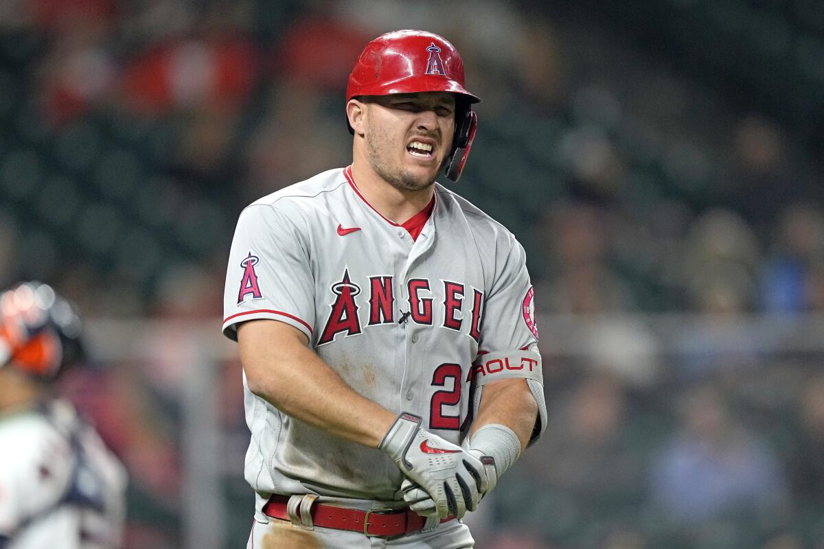 Angels' Mike Trout winces in pain.
