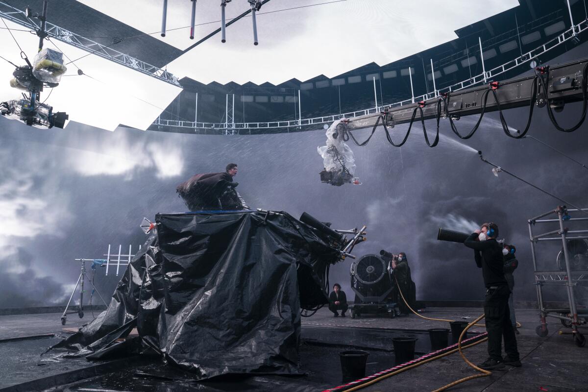 A young actor rides the equivalent of an advanced mechanical bull as he's filmed surrounded by LED screens.