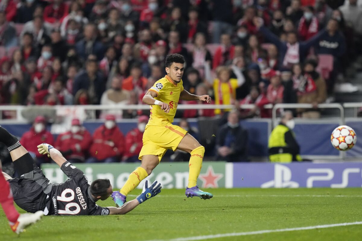 Liverpool's Luis Diaz, right, scores his side's third goal during the Champions League quarterfinals, first leg, soccer match between Benfica and Liverpool at the Luz stadium in Lisbon, Tuesday, April 5, 2022. (AP Photo/Armando Franca)