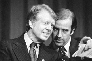 FILE - In this Feb. 20, 1978, file photo, President Jimmy Carter listens to Sen. Joseph R. Biden, D-Del., as they wait to speak at fund raising reception at Padua Academy in Wilmington, Del. (AP Photo/Barry Thumma, File)