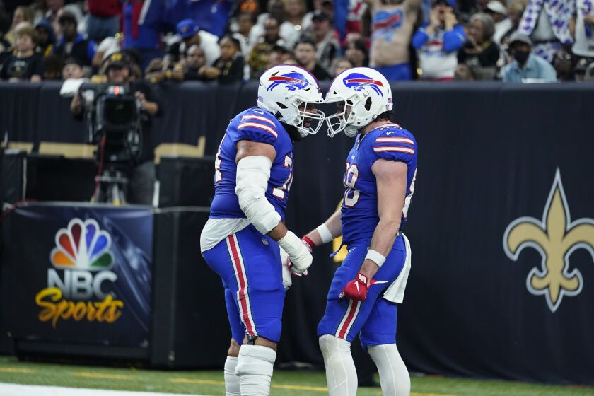 Buffalo Bills tight end Dawson Knox (88) celebrates his touchdown with guard Cody Ford (74) in the second half of an NFL football game in New Orleans, Thursday, Nov. 25, 2021. (AP Photo/Derick Hingle)