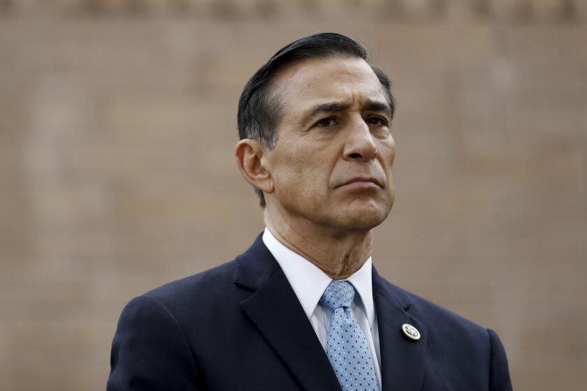 Former congressman Darrell Issa listens during a news conference Thursday, Sept. 26, 2019, in El Cajon, Calif. Issa, a former congressman, announced Thursday he will attempt a return to Congress to replace a fellow Republican. (AP Photo/Gregory Bull)