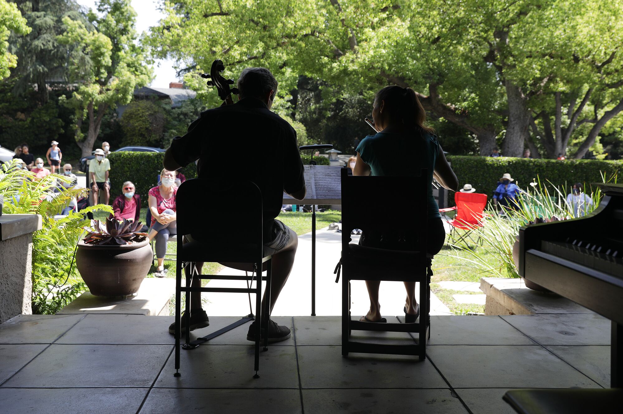 Jonathan and Catherine Karoly perform for a social-distanced crowd on their lawn in Pasadena.