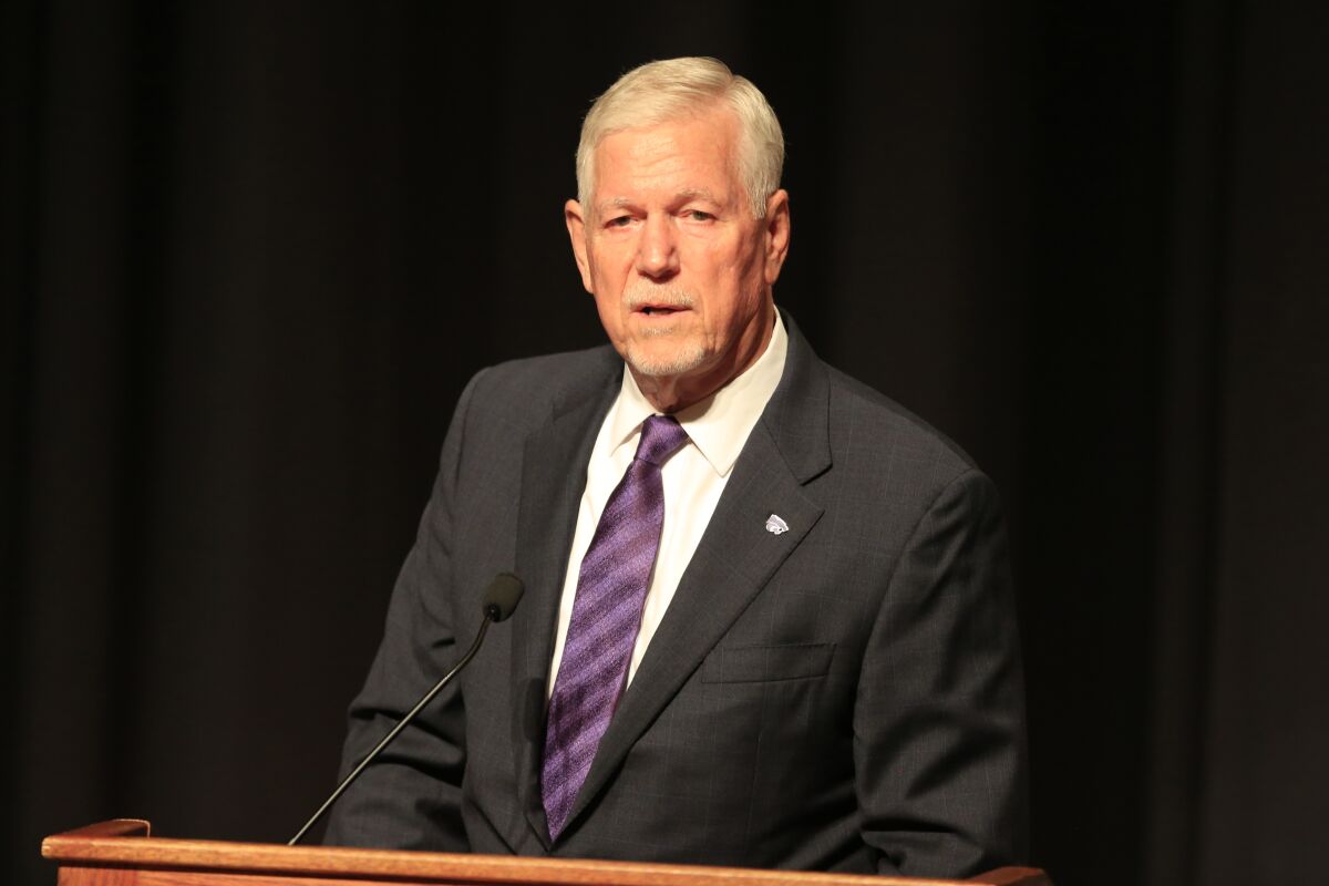Kansas State President Richard Myers speaks during a news conference.