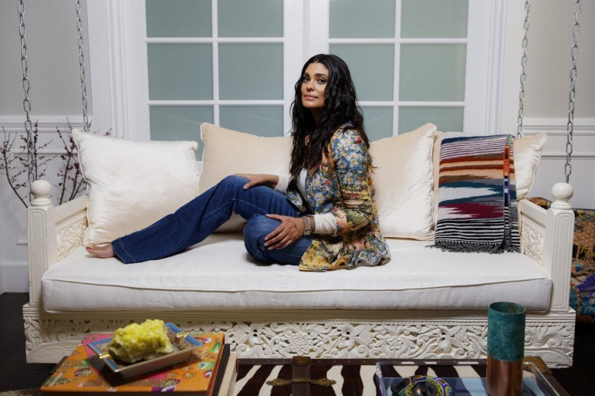 Fashion designer and author Rachel Roy, seen her Los Angeles-area home, has collaborated on a new swimsuit with swimwear designer Melissa Odabash, available at RachelRoy.com. Roy also has plans for a full swimwear collection.