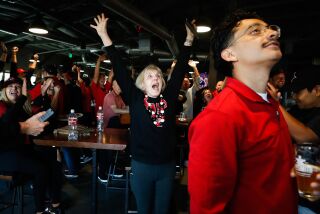San Diego, CA - March 26: San Diego State fans celebrate after the Aztecs' beat Creighton during their Elite Eight matchup at a watch party inside Alesmith Brewery on Sunday, March 26, 2023 in San Diego, CA. (Meg McLaughlin / The San Diego Union-Tribune)