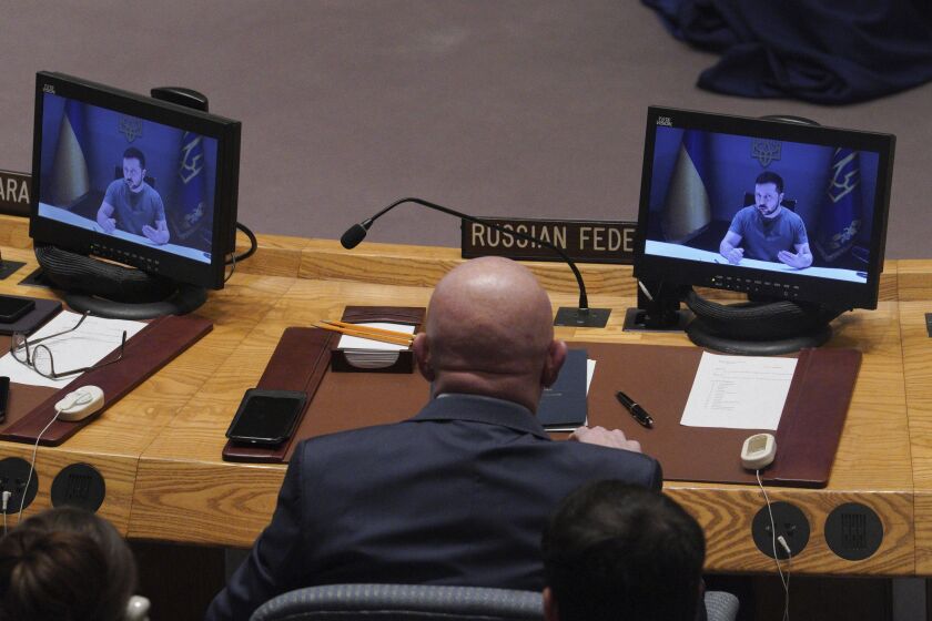 Russia's United Nations Ambassador Vasily Nebenzya listens as Ukraine President Volodymyr Zelenskyy address the United Nations Security Council by video, Tuesday Sept. 27, 2022 at U.N. headquarters. (AP Photo/Bebeto Matthews)