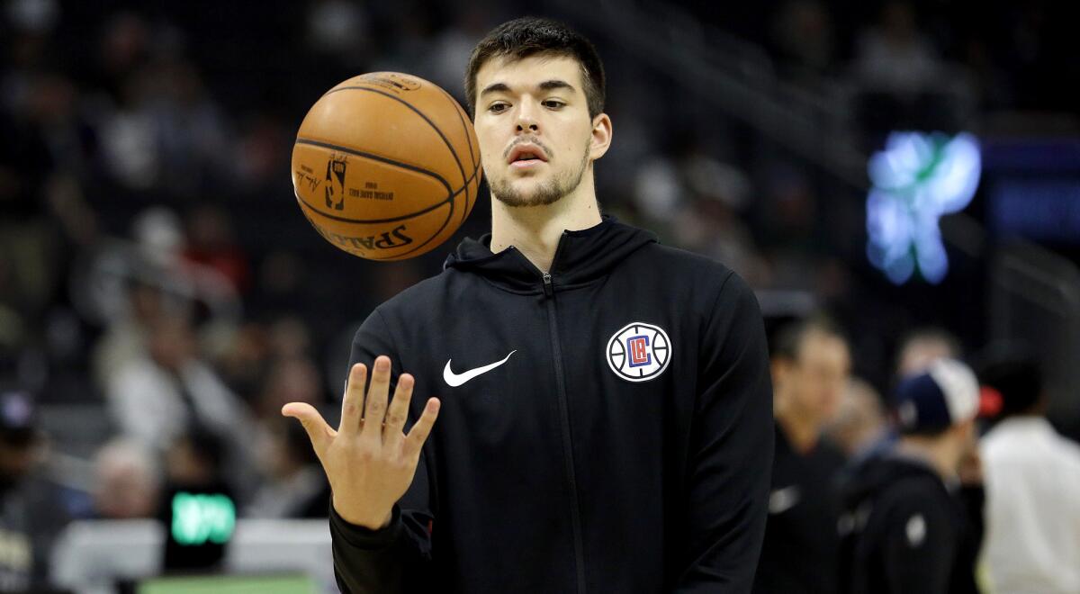 Clippers center Ivica Zubac prepares to warm up before a game against the Milwaukee Bucks on March 28, 2019.